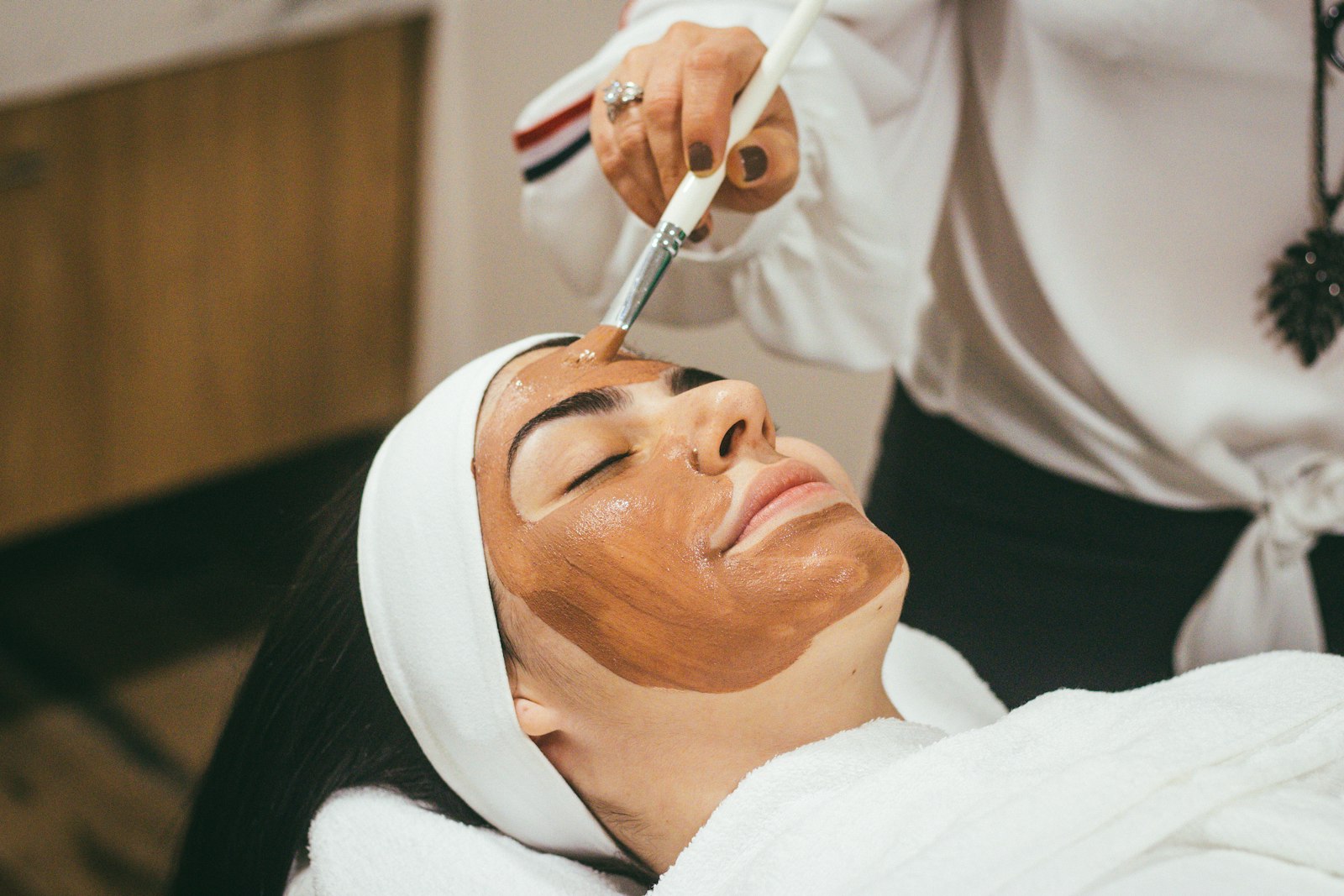 Beauty therapist giving a client a treatment